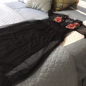 Evening pants suit with tulle overlay.